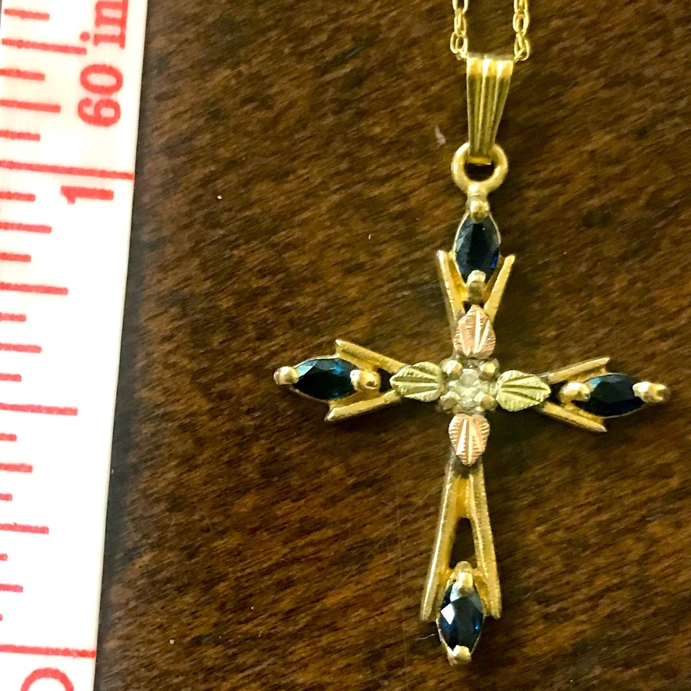 10k Gold necklace with 1” cross with small diamond and 4 small sapphires